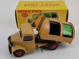 a toy truck that is sitting in front of a box