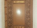 the book is brown and has gold lettering on it
