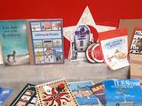 a lot of books on a table with a star in the background