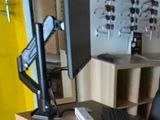 a desk with a computer, keyboard, mouse, and glasses on it