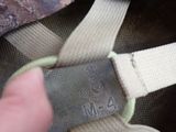 a person holding a piece of luggage with a tag attached to it
