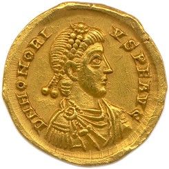 une pièce d'or sur laquelle figure l'effigie d'une femme portant une coiffe