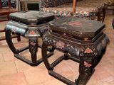 pair of oriental style stools and ottomans in a living room