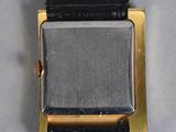 a close up of a watch with a black strap