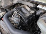 a close up of a car ' s engine with its hood open