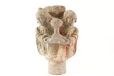 a small vase with animals in it on a white surface