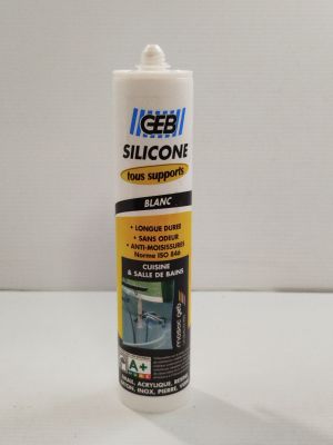 un flacon de colle blanc posé sur une table
