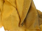 mustard colored scarf with fringes on a white background