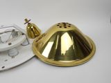 a white plate with a gold lamp on it and a white plate with a gold lamp on it