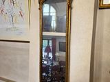 a mirror hanging on the wall in a room