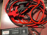 a bunch of wires and a charger on a table