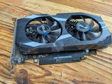 a close up of a video card sitting on top of a wooden table