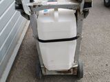 a white container on a cart with a handle