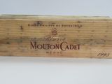 a wooden box with a label on it that says moutonccade