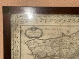 a picture of a framed map on the wall