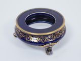 a blue and gold plate with a horse on it