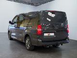a grey van that is parked in a room