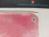 a picture of a pink cell phone sitting on a table