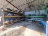 a garage with a lot of tools on the shelves