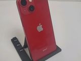 an apple iphone is sitting on a stand on a white surface