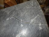 a marble table with a crack in the middle of it