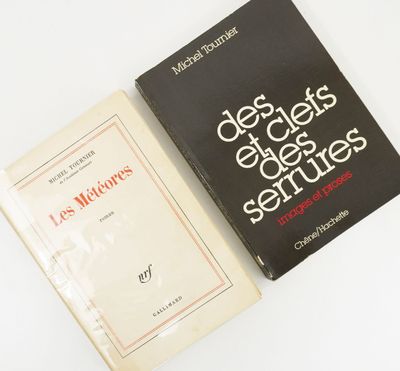 two books sitting next to each other on a white surface