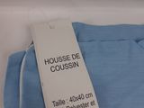 blue pants with a tag on the back of them
