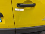 a close up of a door handle on a yellow car