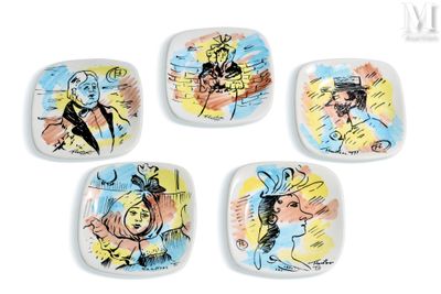 four square plates with different designs on them on a white surface