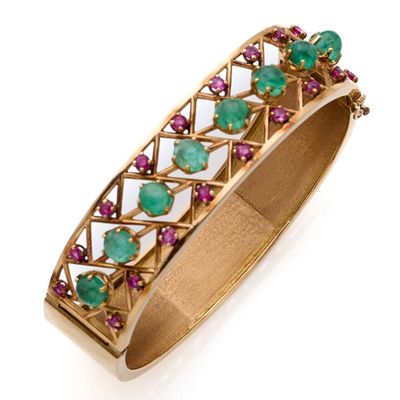 Bracelet jonc rigide ouvrant en or 18k (750e), orné d'une li…