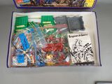 a box with a bunch of toys in it on a table