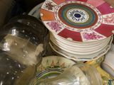 a box full of plates and a jar with a lid