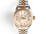 an image of a lady ' s rolex watch on a white background
