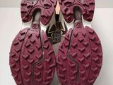the soles of a pair of hiking shoes on a white surface