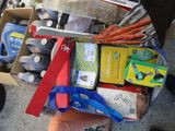 a box full of assorted items on the ground