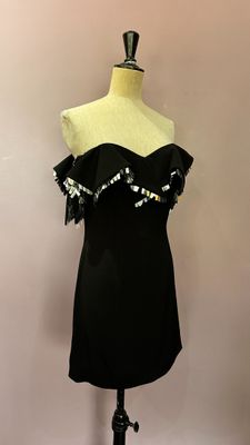 a black dress on a mannequin on a mannequin stand