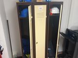 two lockers in the corner of a room next to a fire hydrant and a fire hydrant