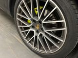 a close up of a car tire with a yellow sticker on it