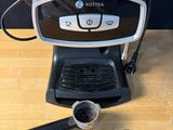 a coffee maker that is sitting on a table