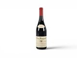 a bottle of red wine sitting on top of a white surface