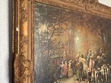 a painting hanging on the wall of a room