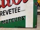 a sign for a liquor store on the side of the road