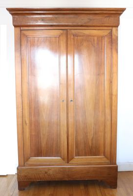 an image of a wooden armoire in a living room