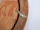 a piece of wood with a knife stuck in it