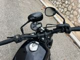 a black motorcycle parked on the side of the road