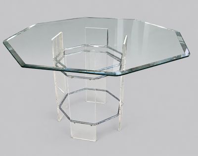 a close up of a table with a glass top on a grey background