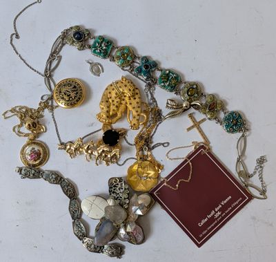 a lot of jewelry that is laying out on the table
