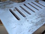 a white plastic tray sitting on top of a pile of hay