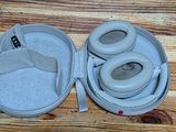 a pair of headphones in a case on a wooden table