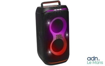 a black speaker with a red light on top of it